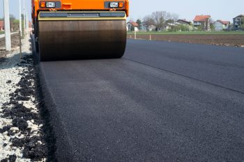 road construction vehicle paving road